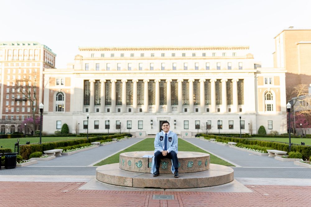 Graduation photo in front of Butler Library at Columbia University.