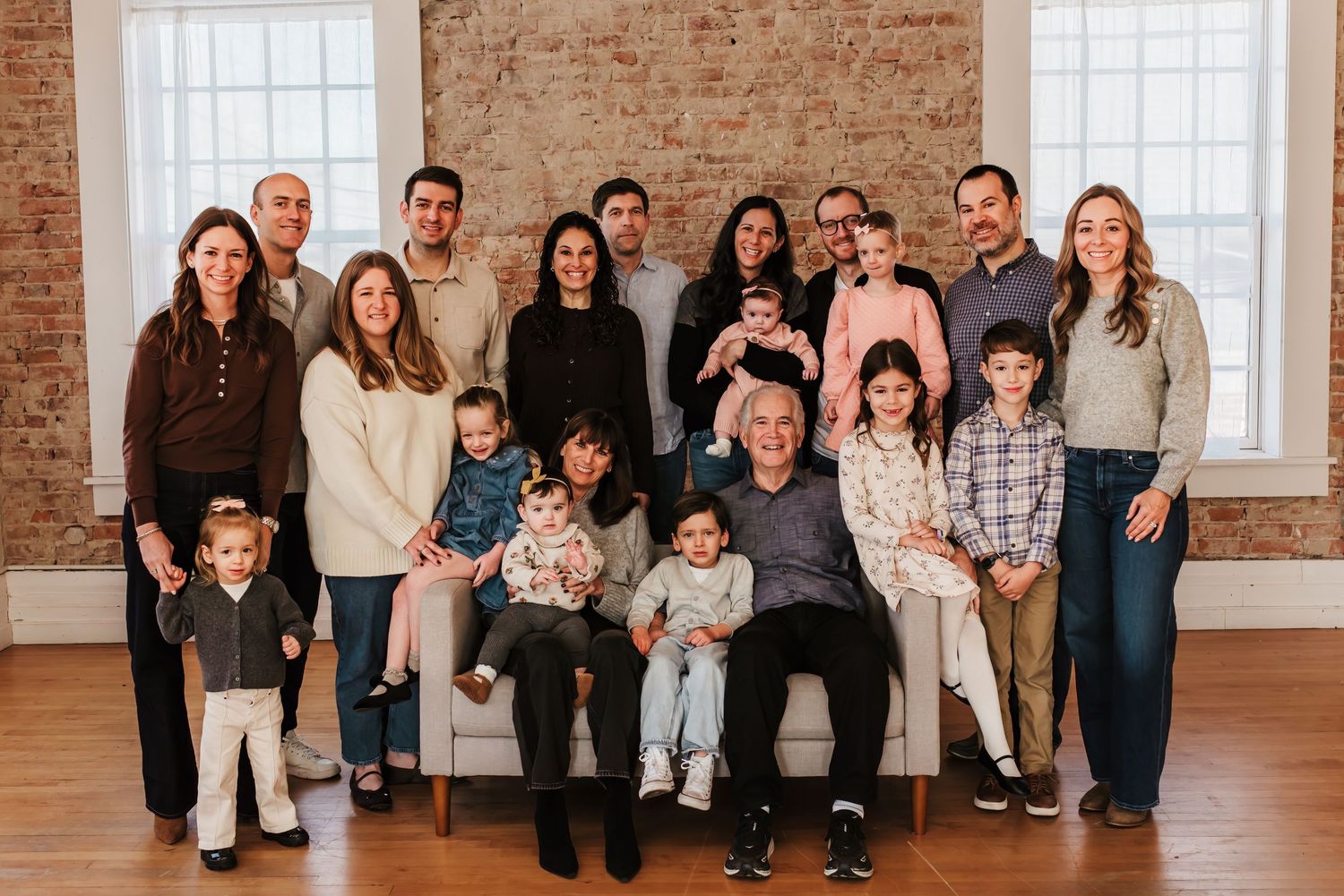 Extended family  gathers together for a family photo session to capture memories that will last for generations.