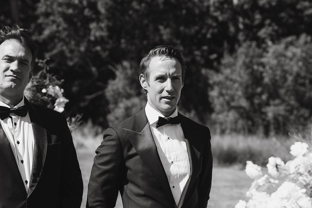 Groom waiting for his bride's arrival at ceremony.