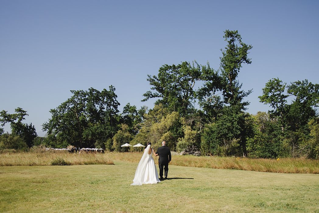 Bride and father approaching ceremony.
