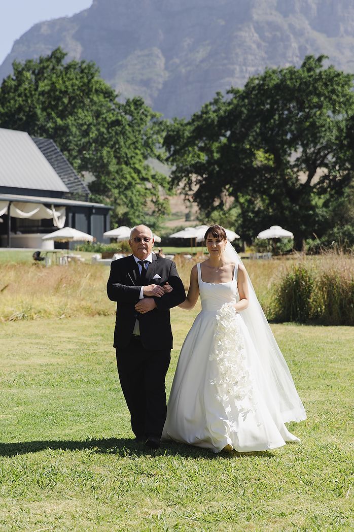 Bride and father approaching ceremony.