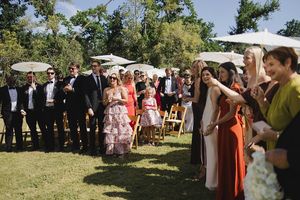 Guests at the end of the ceremony, standing for bride and groom's exit.