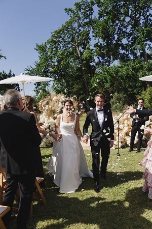 Bride and groom confetti moment existing the ceremony.