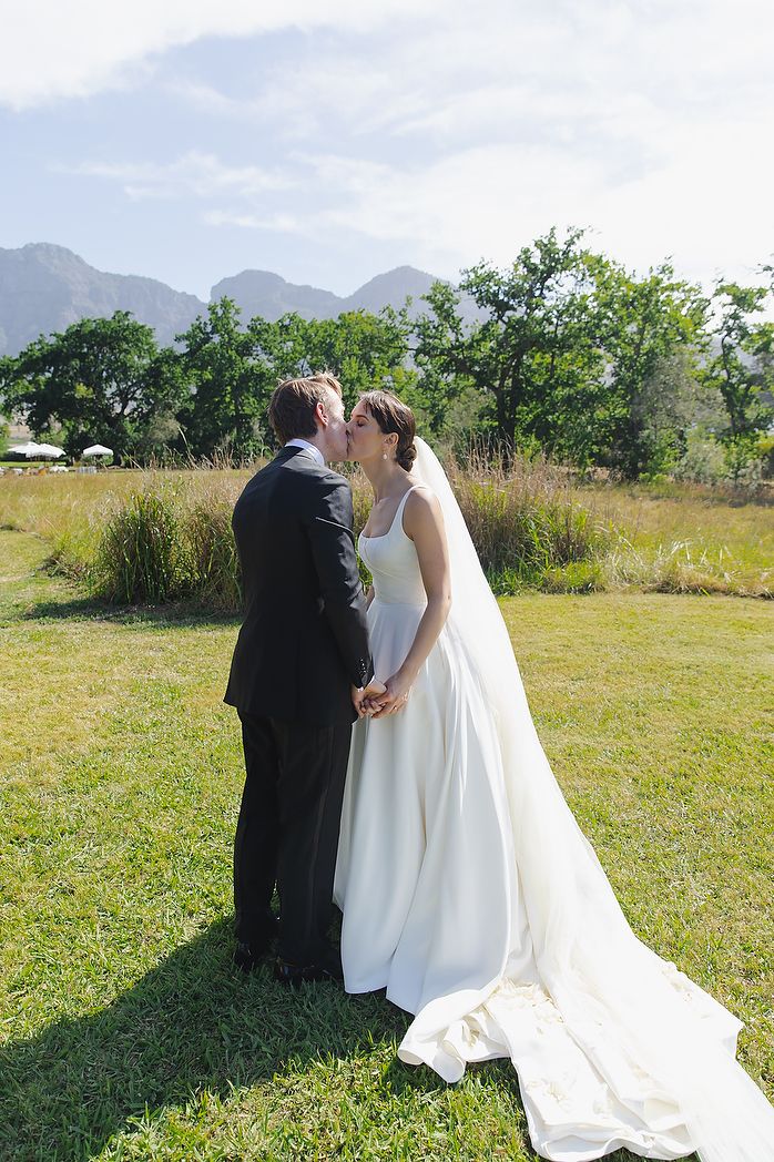 Bride and groom sharing a kiss after the ceremony.