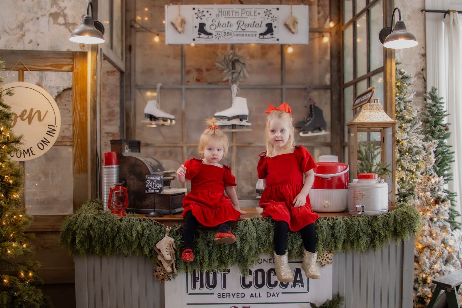Holiday family portraits in Cincinnati featuring loving parents and their two daughters captured in a natural candid moment.