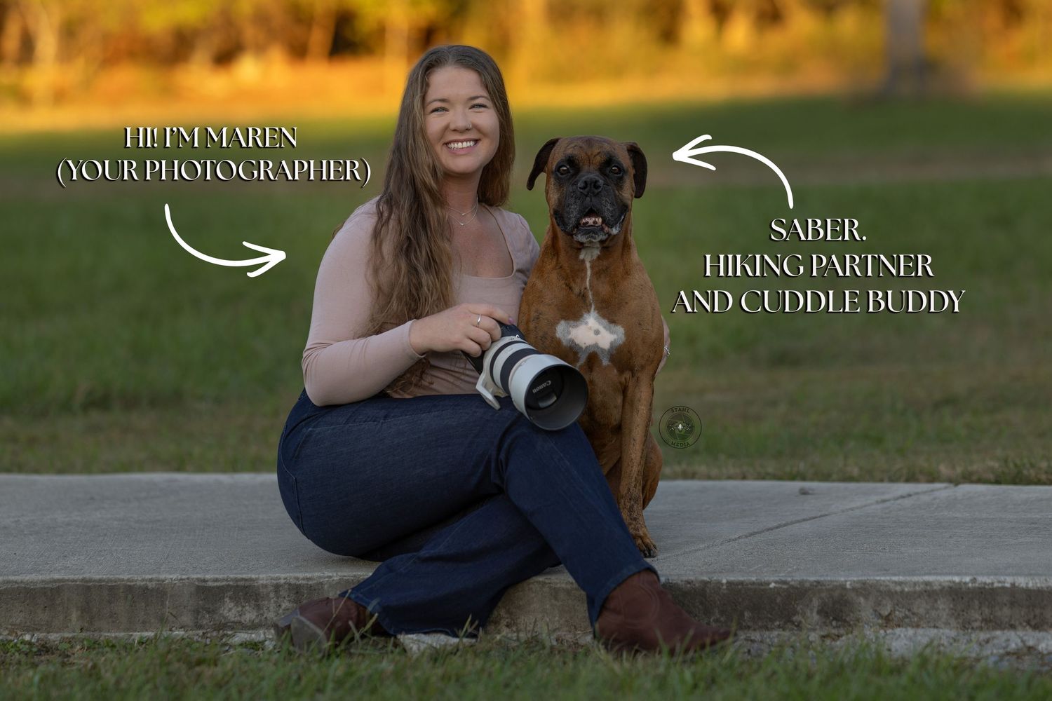A photographer in casual attire sits on outdoor steps with a black dog while holding a camera during golden hour.