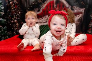 A series of holiday photos showing a child in white pajamas with red accents on a red background.