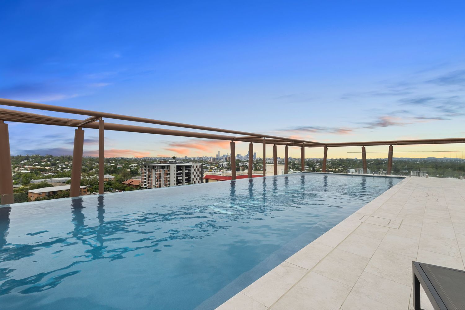 Luxurious infinity pool overlooking the ocean with panoramic views of the coastline.