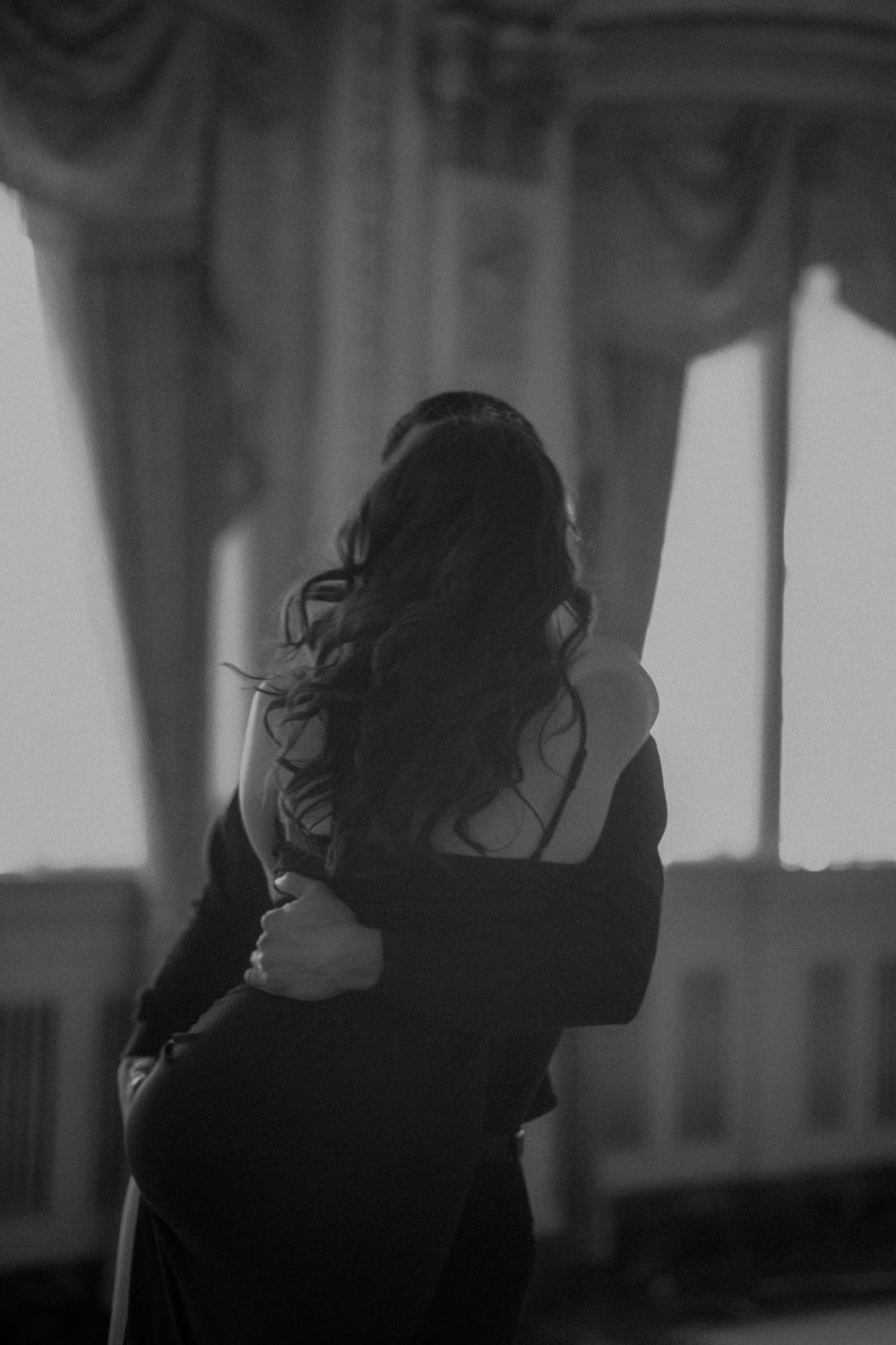 A sequence of black and white photos showing a silhouetted figure with flowing hair in dramatic motion.