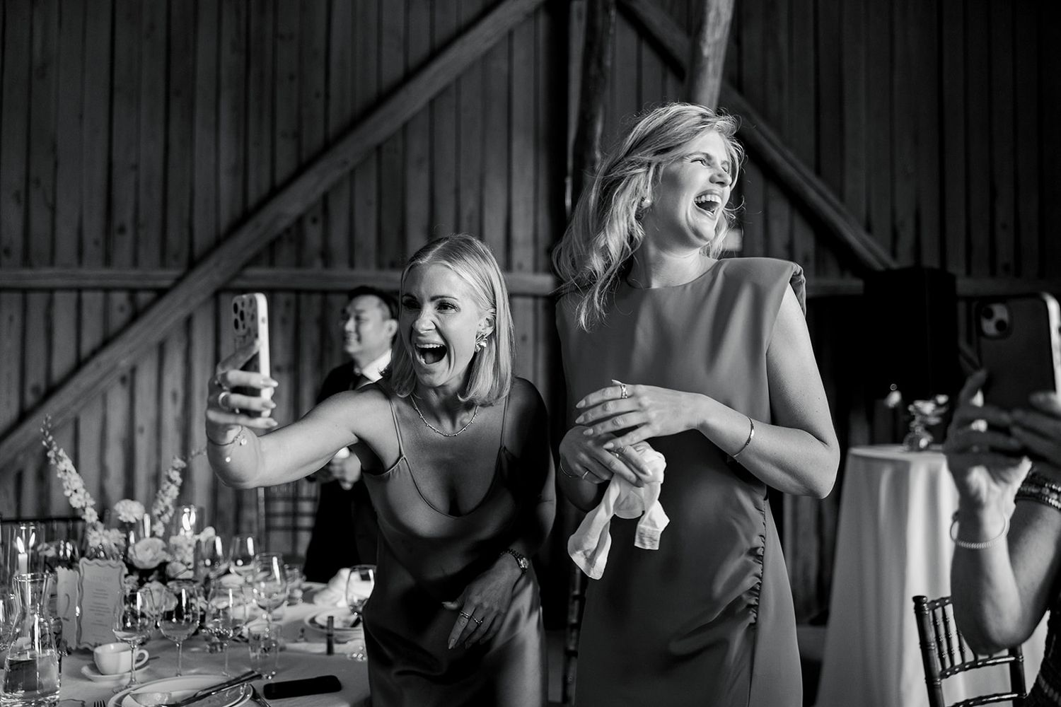 A sequence of black and white wedding reception photos showing dancing, laughter and joyful celebration moments.