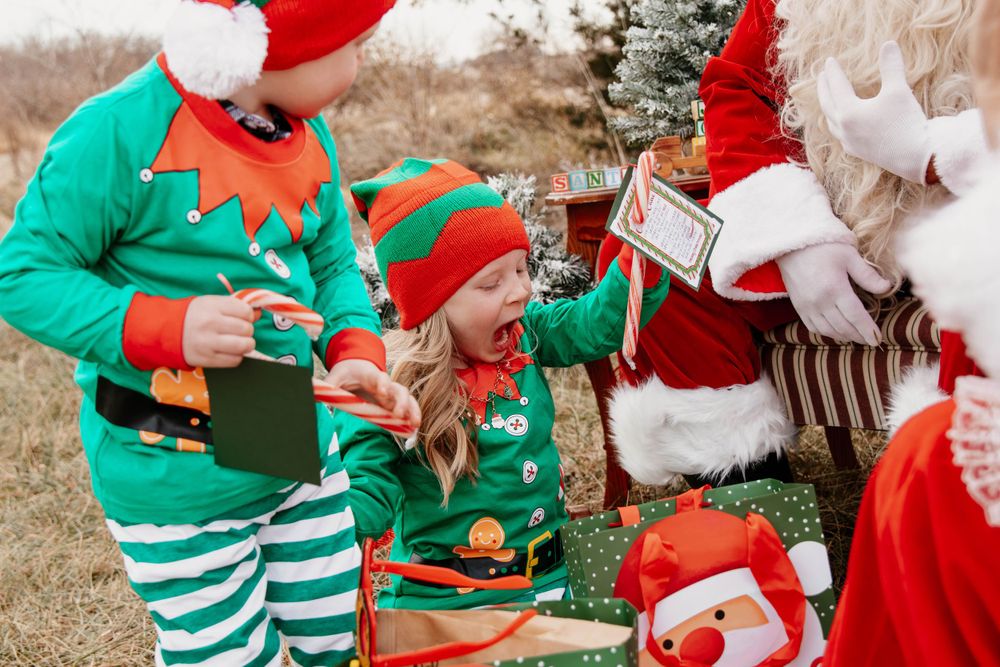 Holiday characters in matching striped outfits gather around during a Christmas celebration.