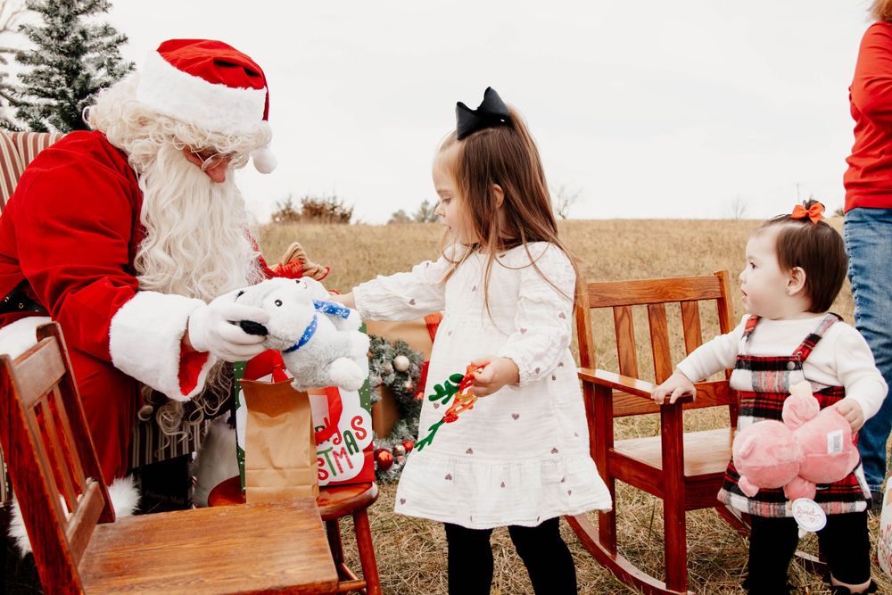 A charming holiday scene with classic decorations and wooden bench outdoors.