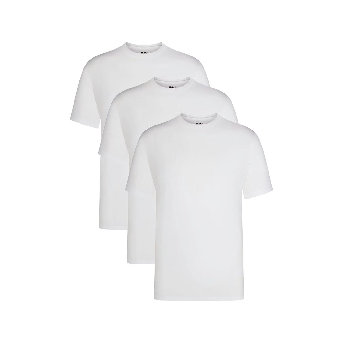 Three plain white crew neck t-shirts stacked and arranged in a row against a white background.
