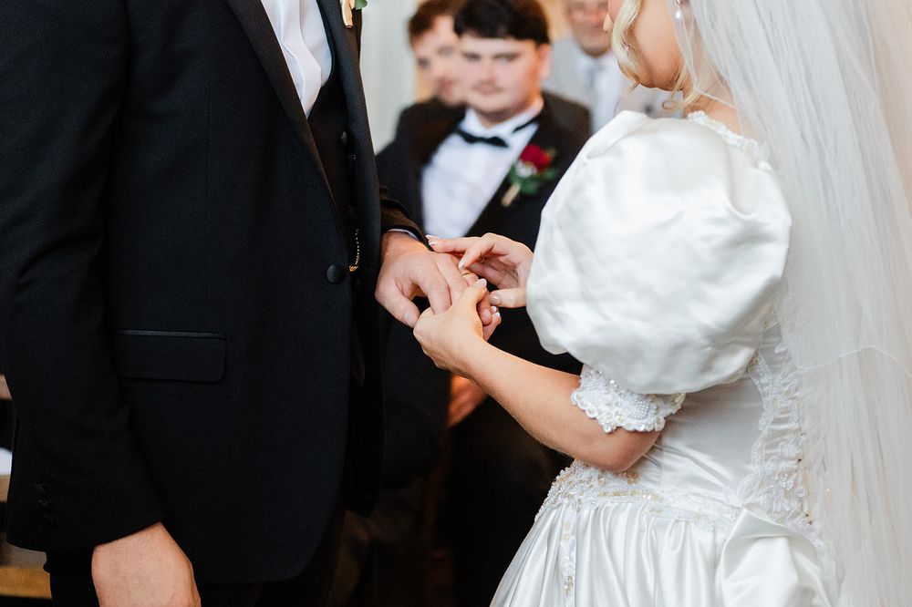 A bride and groom share an intimate dance during their wedding reception.
