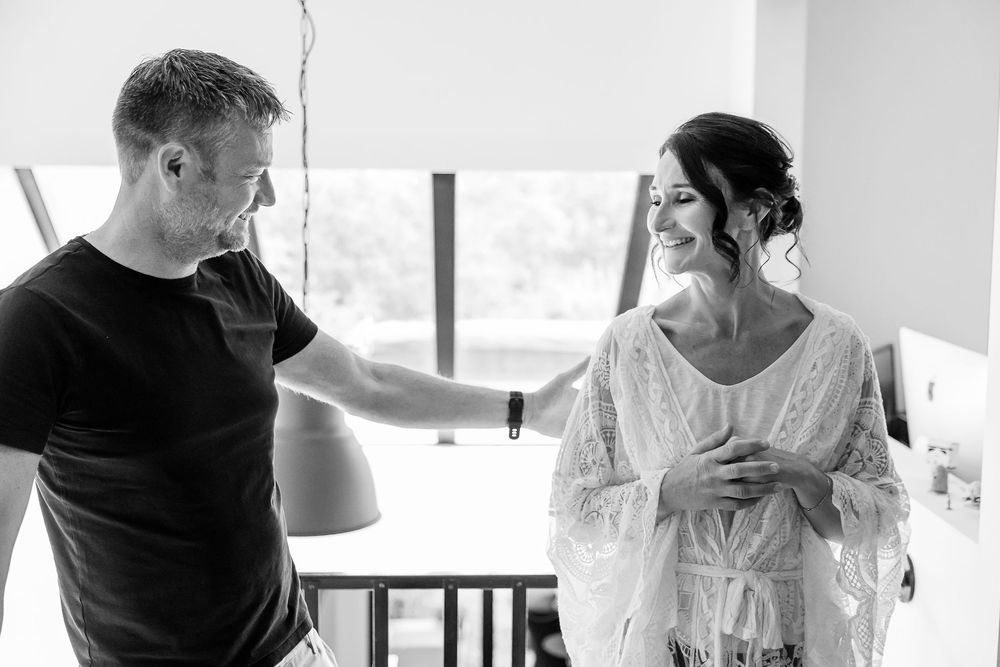 A couple shares an intimate moment during their wedding day celebration.