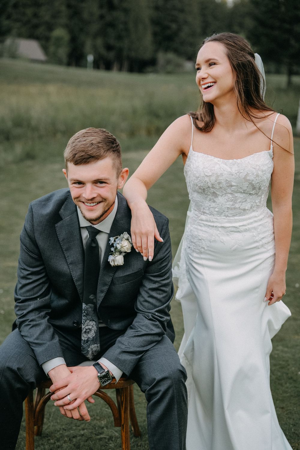Candid wedding portraits showing playful moments between newlyweds outdoors.