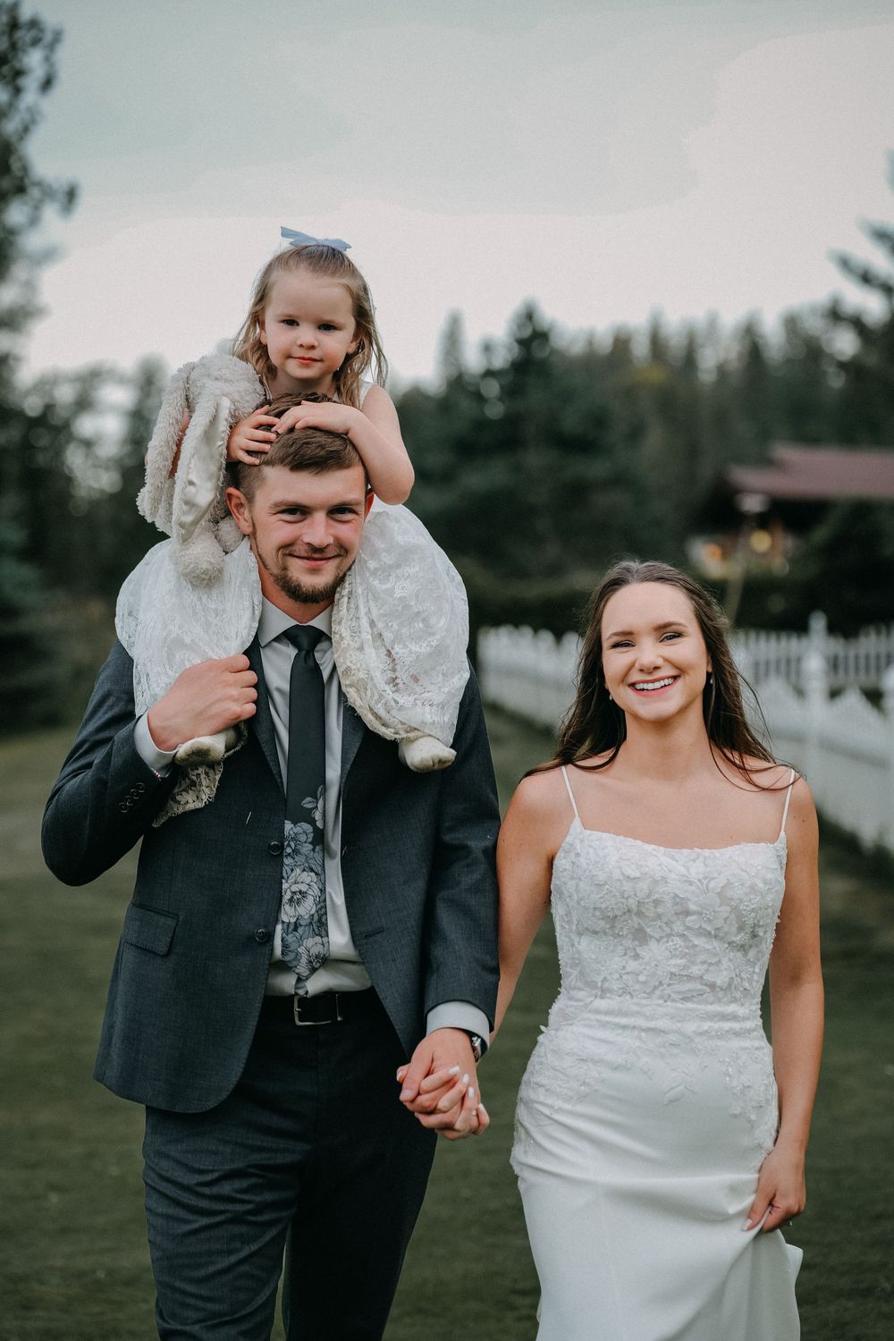 Playful wedding couple shares joyful moments during their outdoor mountain celebration.