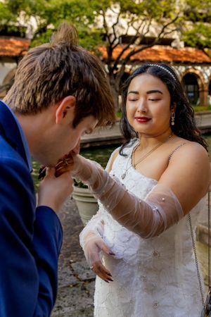 A romantic wedding sequence shows a couple in formal attire sharing tender moments outdoors.
