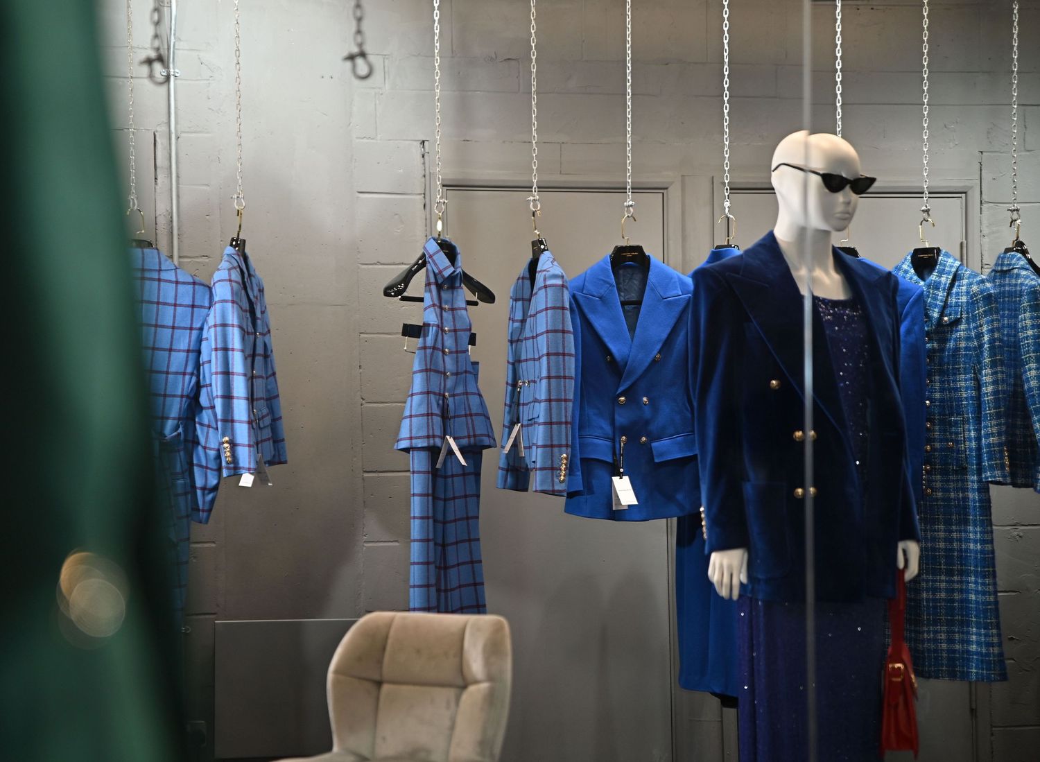 clothes hang on a rail, showcases the designers outfits during London Fashion Week.