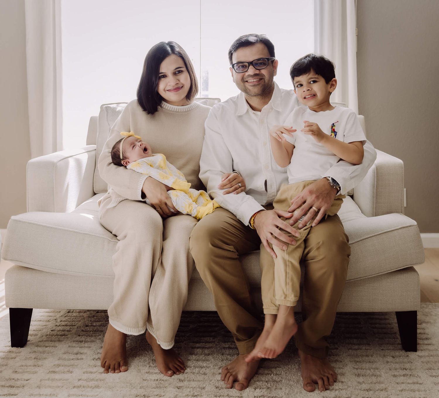 Lifestyle in-home newborn photography session in Union City with parents and baby