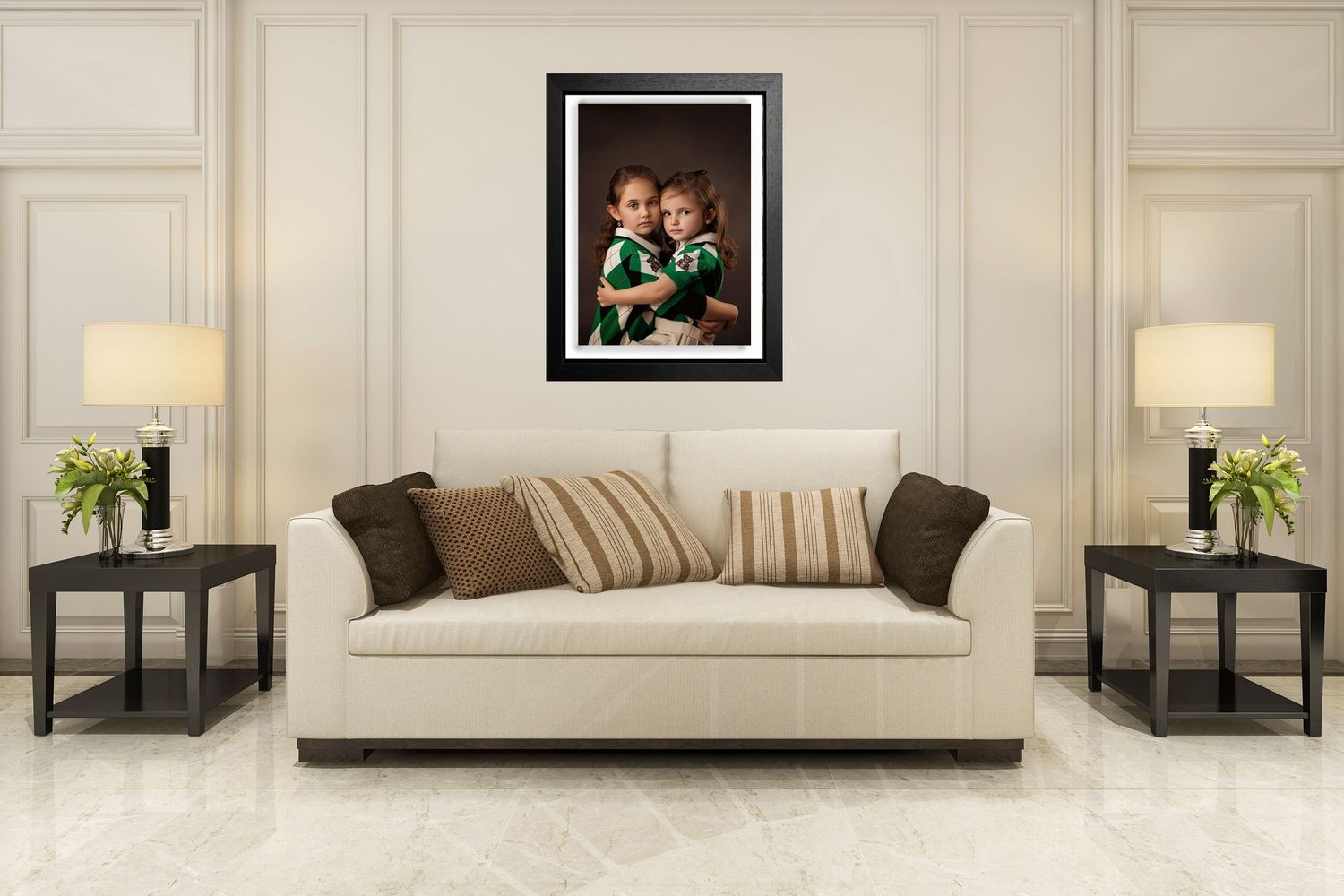 Modern living room featuring cream sofa, matching lamps, and framed artwork on beige wall.