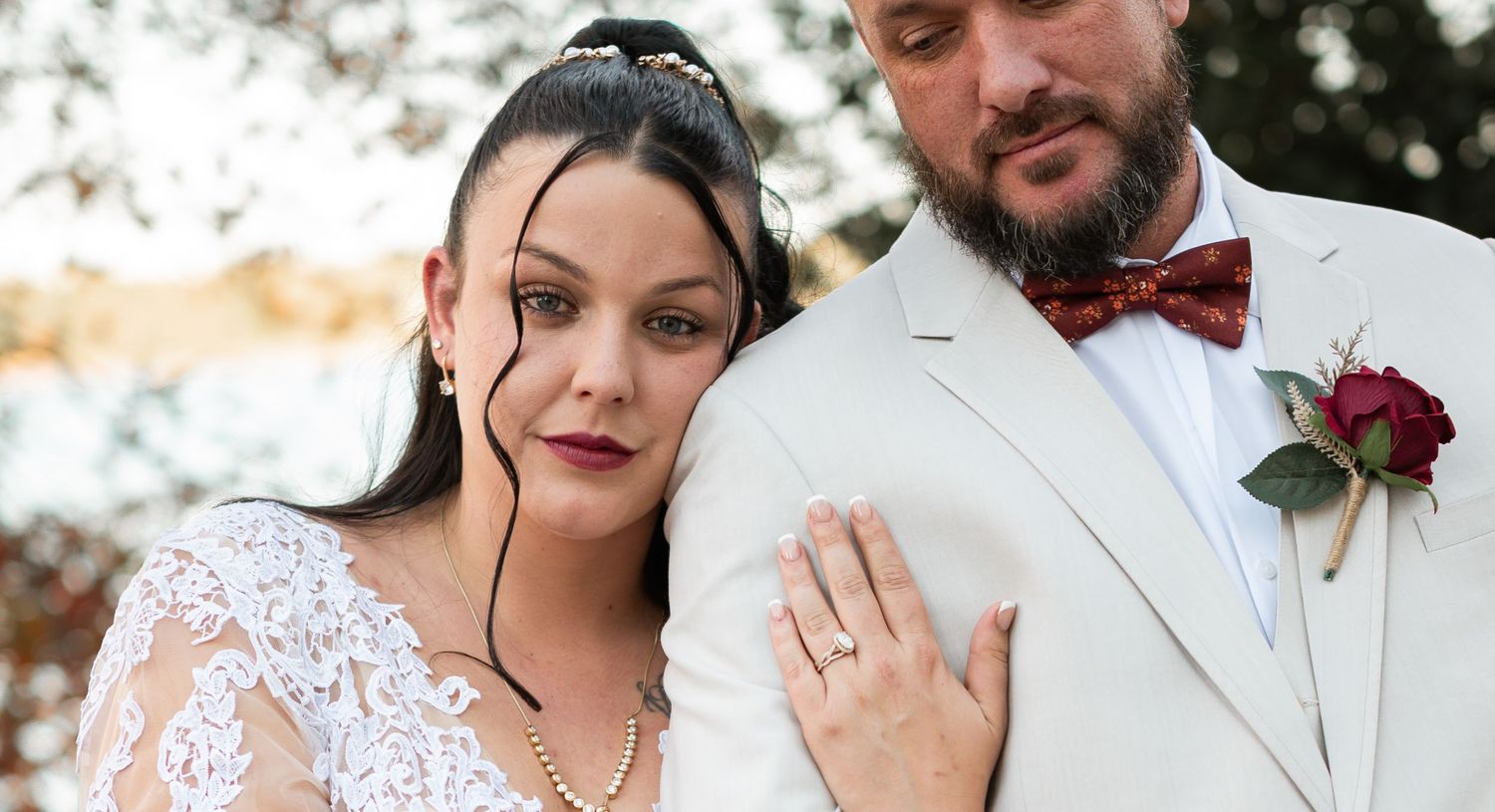 man and woman posed for their wedding
