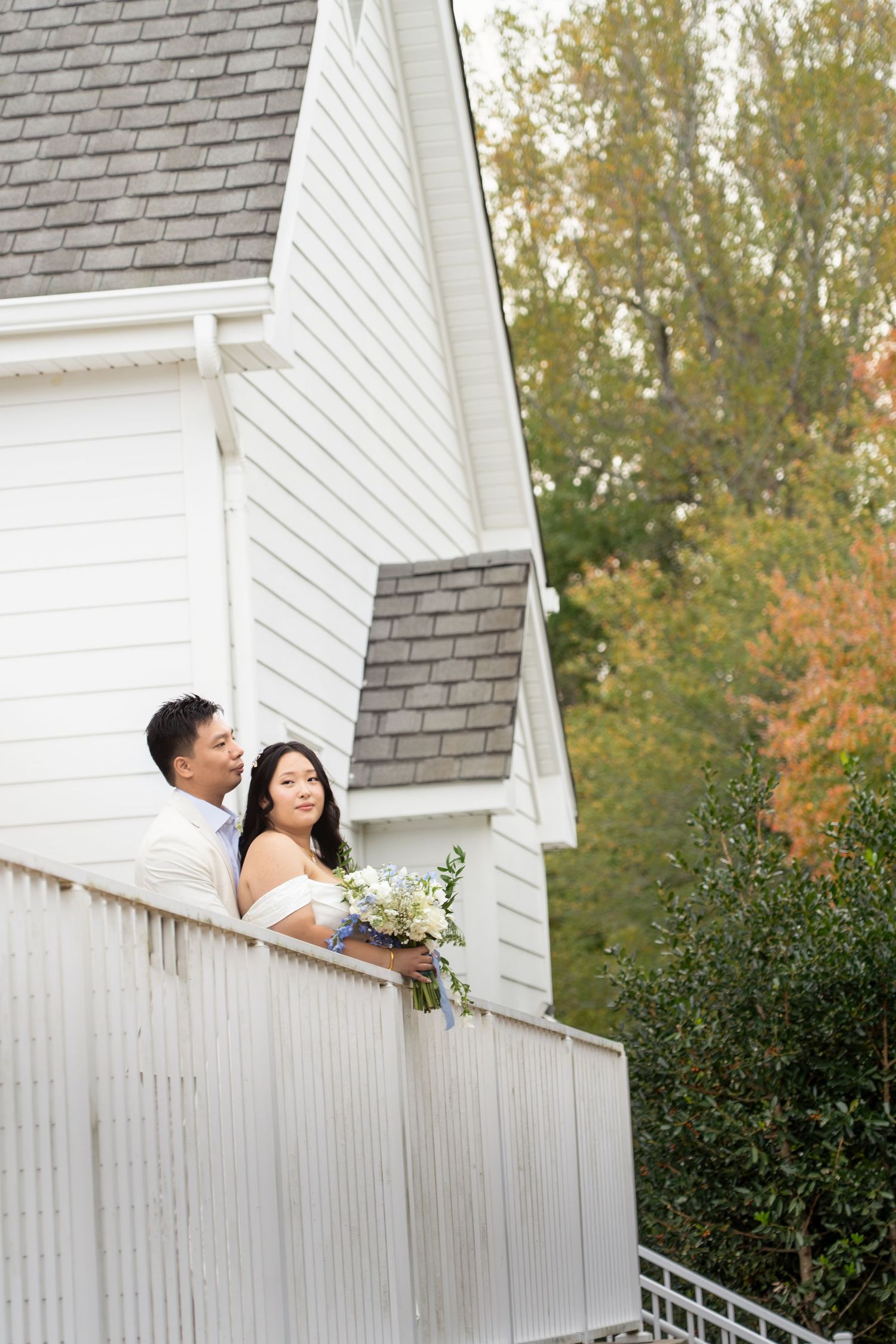 Editorial shot of asian couple on a balcony