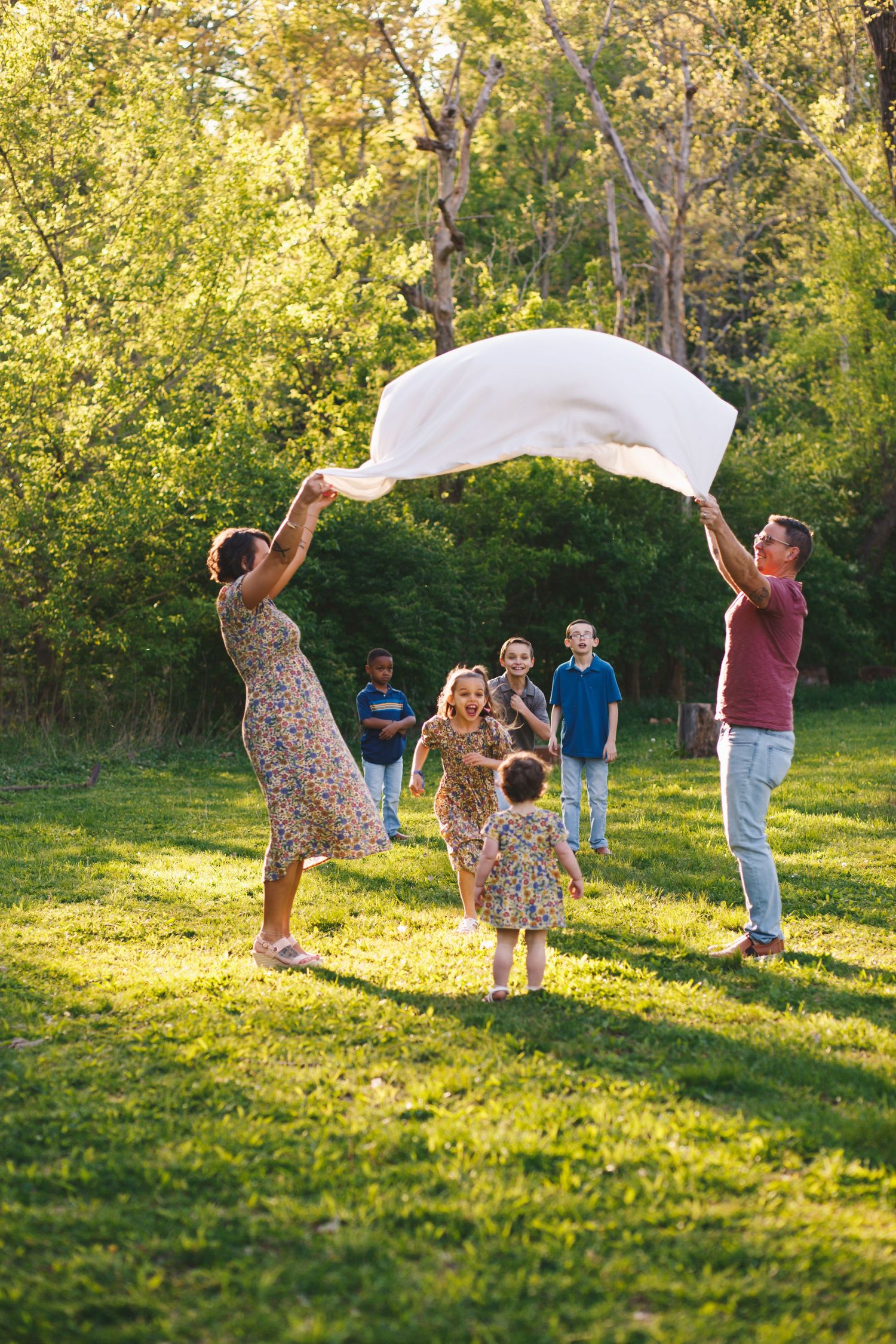 Playful family of seven having fun together in an outdoor photo session