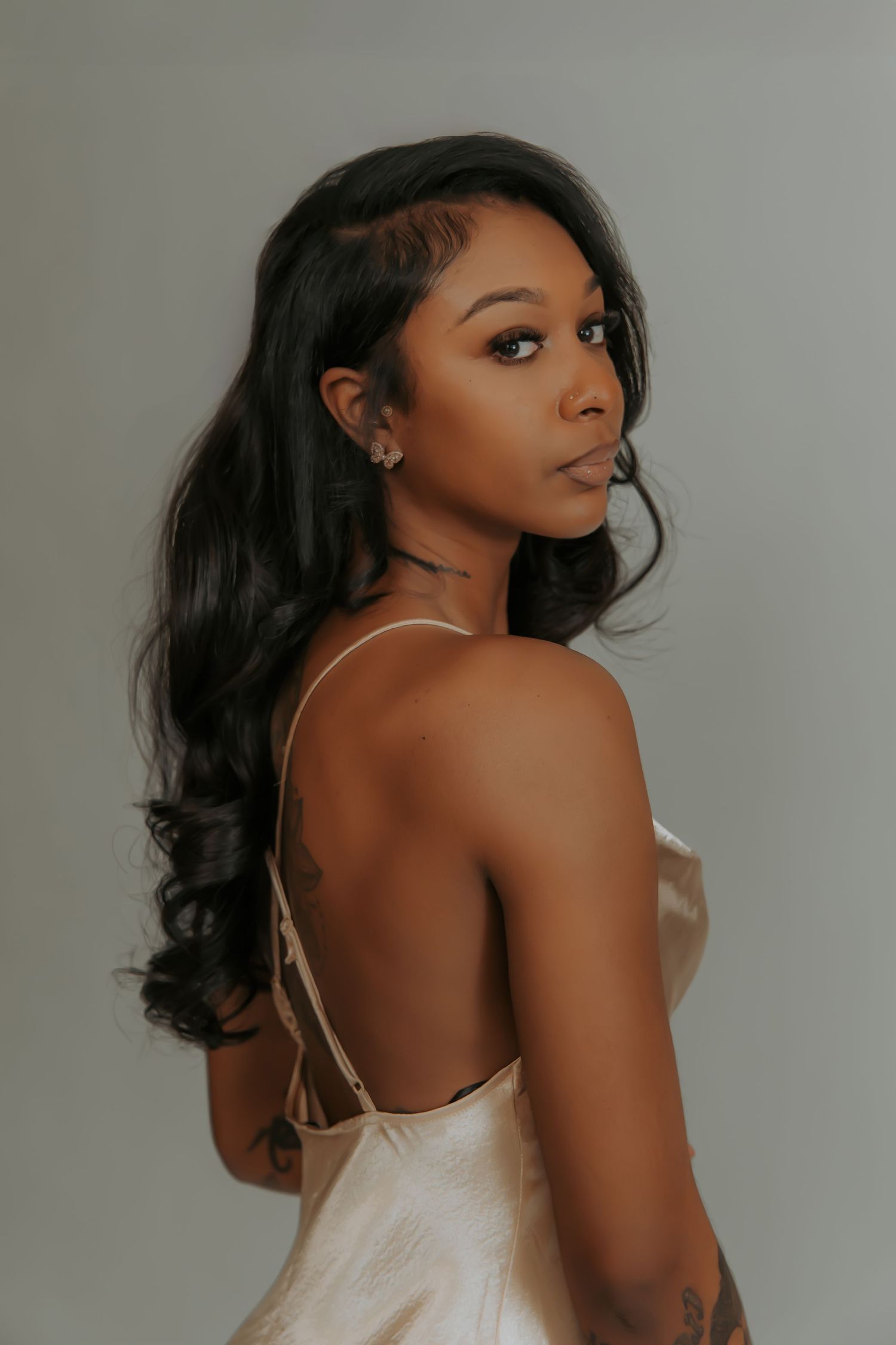 Elegant boudoir portraits featuring satin camisole against light gray background.