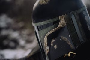 Close-up of Mandalorian cosplay helmet, showcasing its finish and intricate design details.