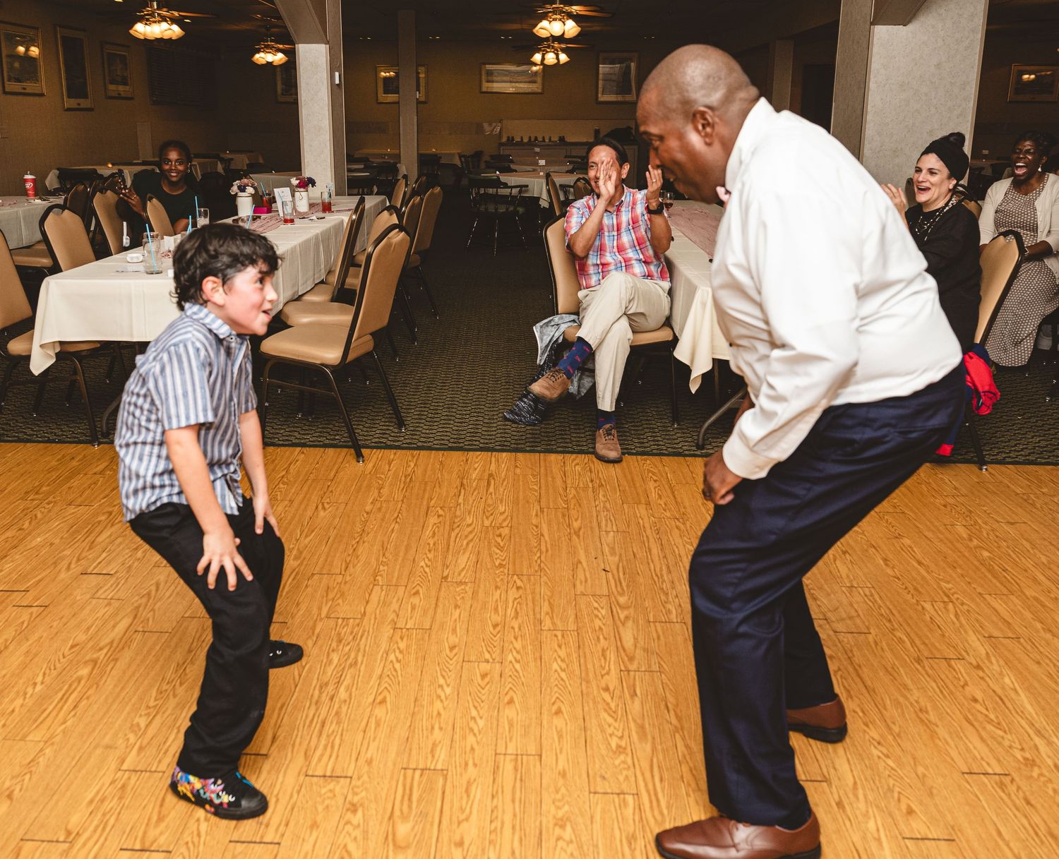 A sequence of dance instruction photos showing a couple practicing swing dance moves on a wooden floor.