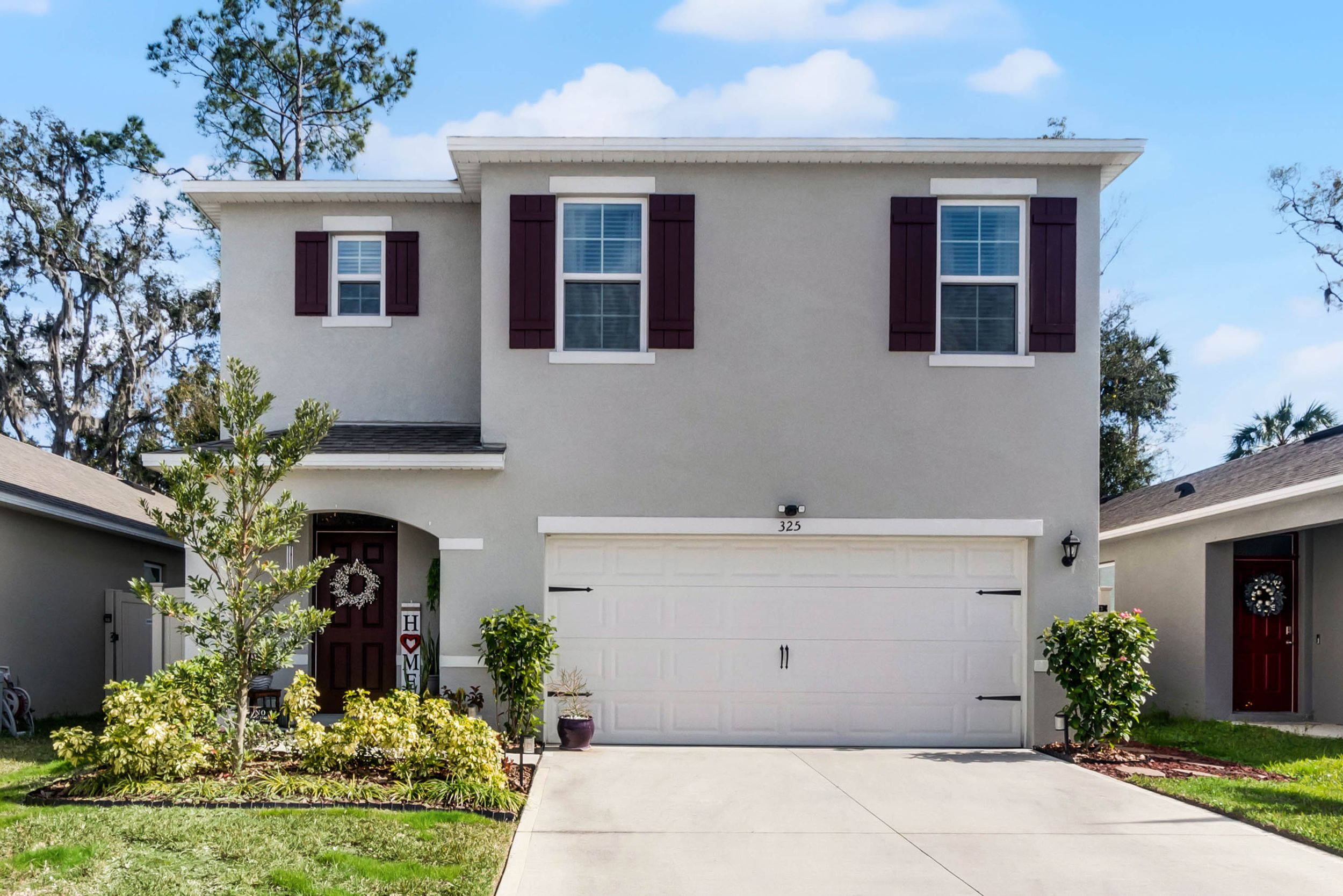 Exterior view of new construction single-family homes in suburban neighborhood.