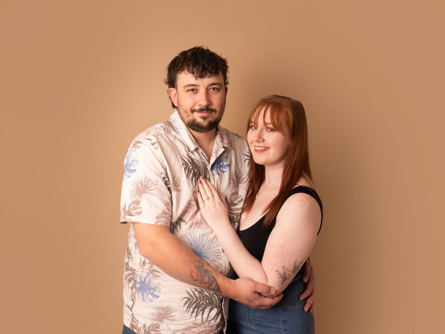 mum and dad in relaxed natural pose smiling for couple photos during family photoshoot in Doncaster.