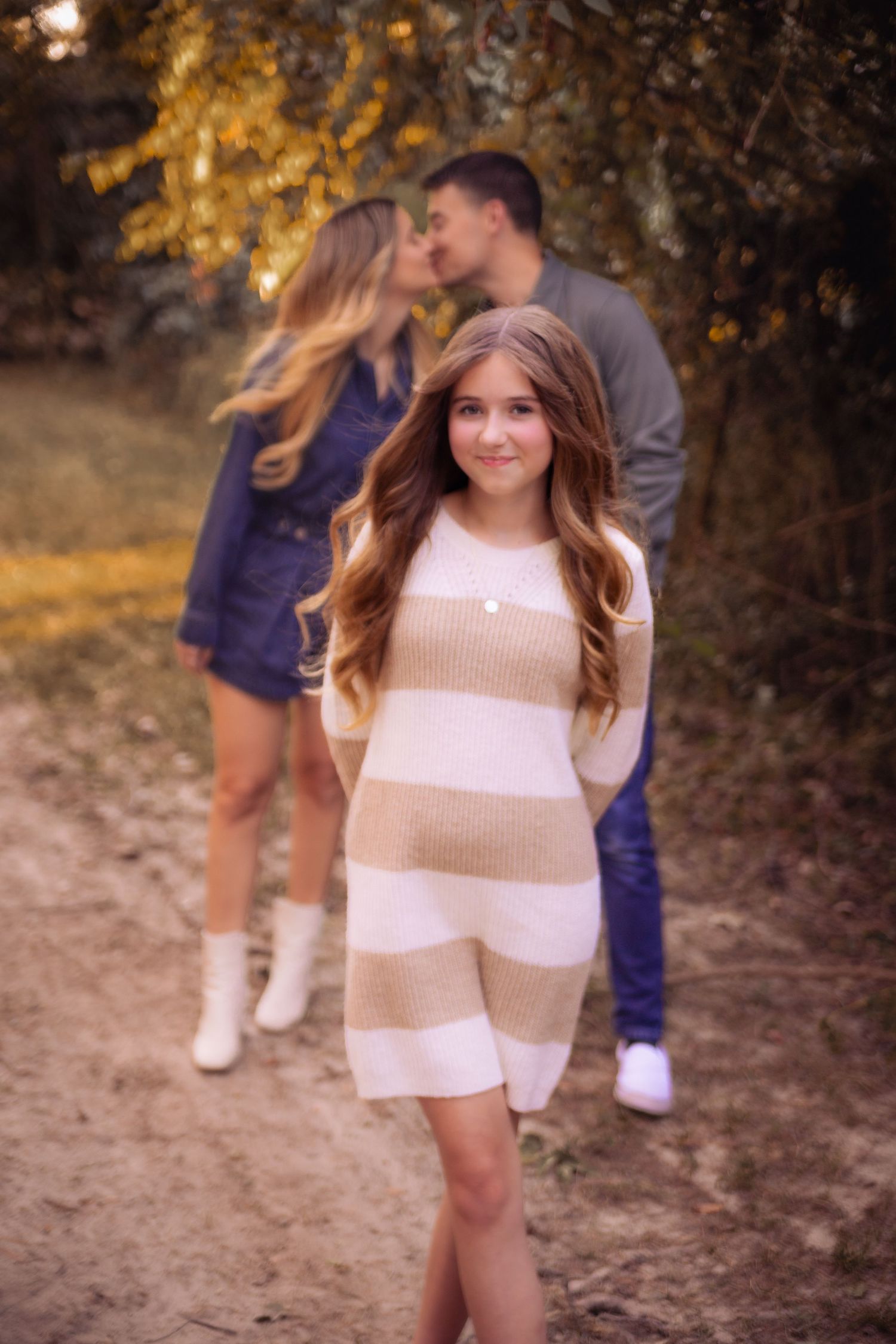 Outdoor family photos in warm autumn lighting wearing coordinated neutral outfits during sunset at Kickerillo Mischer Preserve
