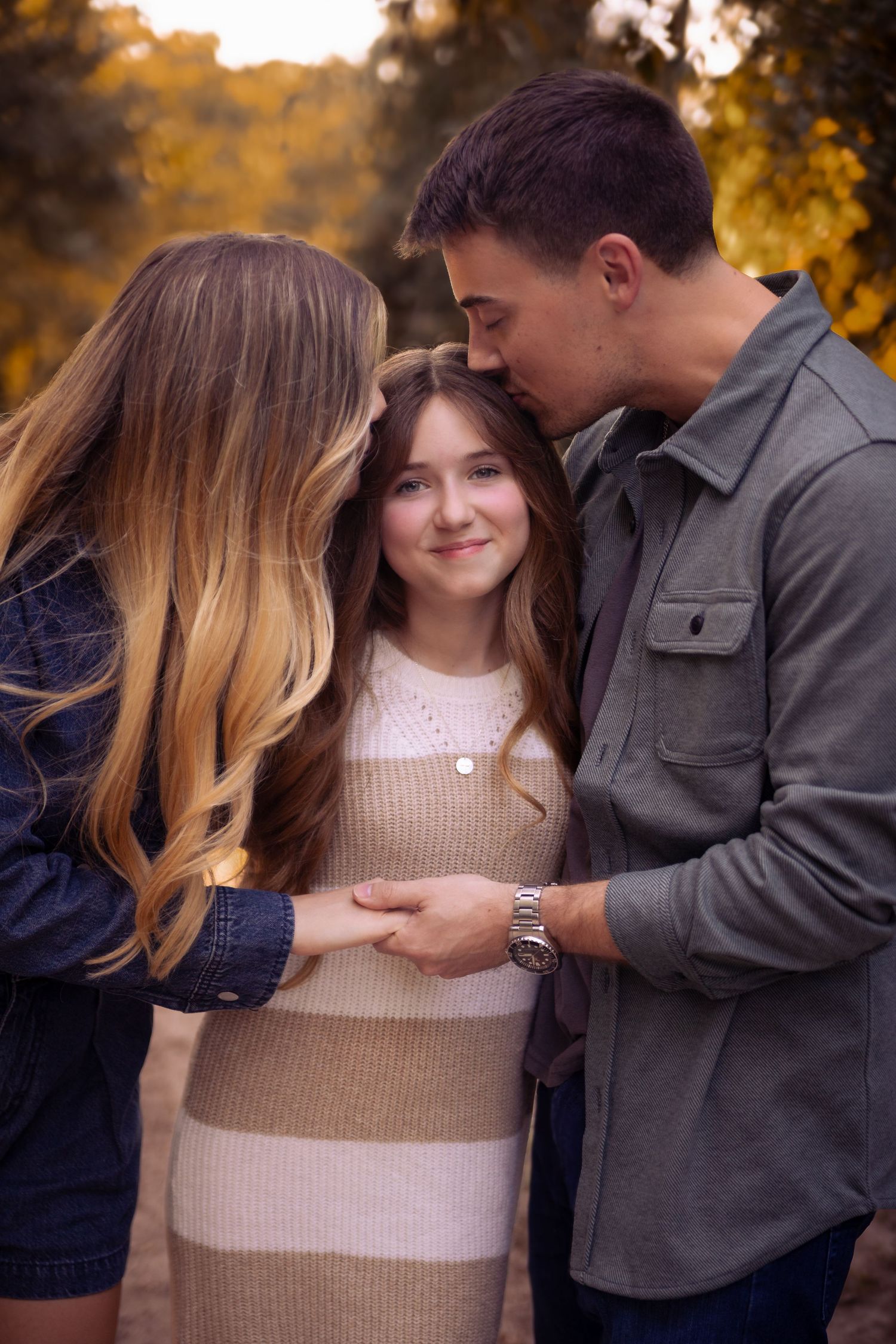Family portrait session at sunset with soft lighting and neutral colored clothing during golden hour at Kickerillo Mischer Preserve.