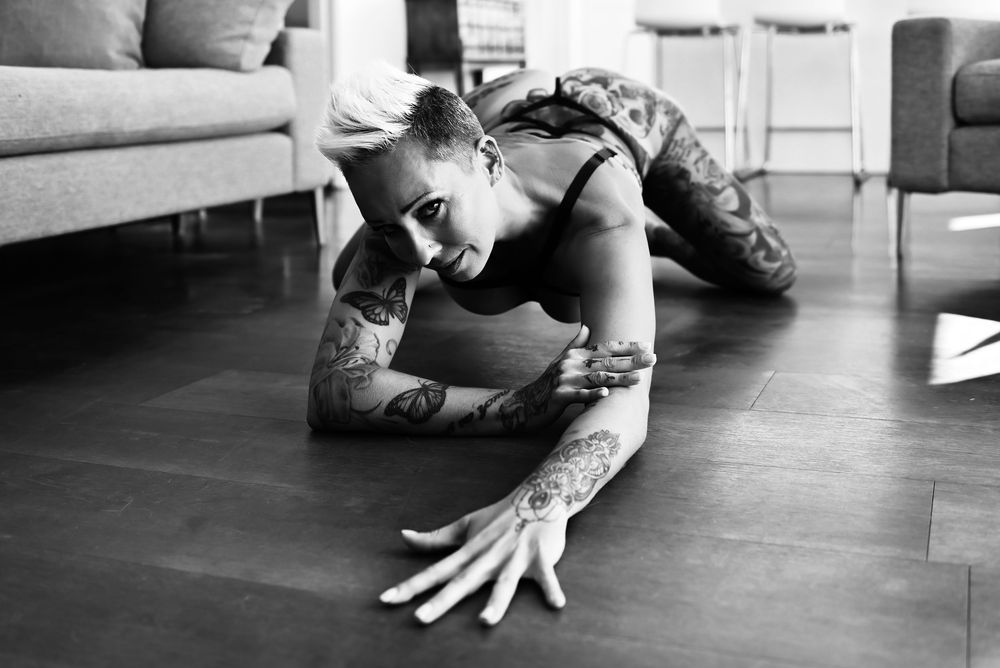 Black and white artistic floor poses showing dramatic angles and shadows.