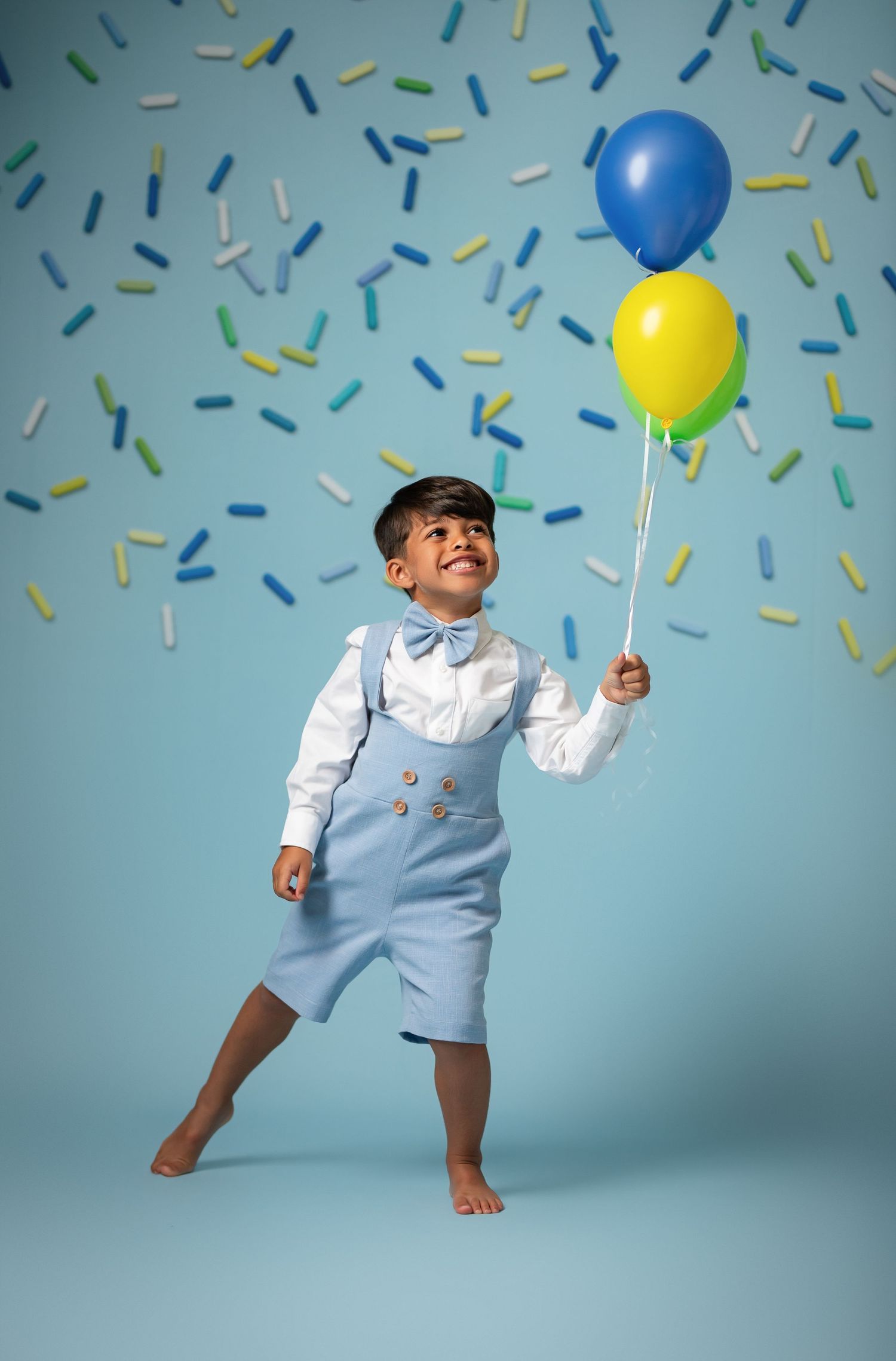 A collection of professional newborn photography poses showcasing different props including bowls, crates, beds and swings.