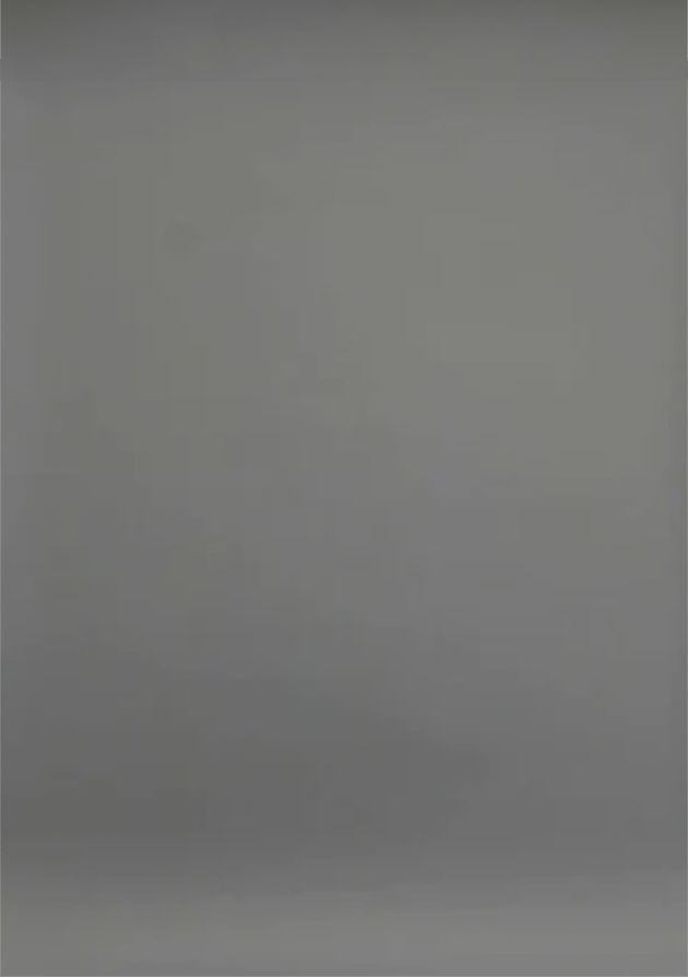Plain grey photography backdrop with gradient lighting effect.