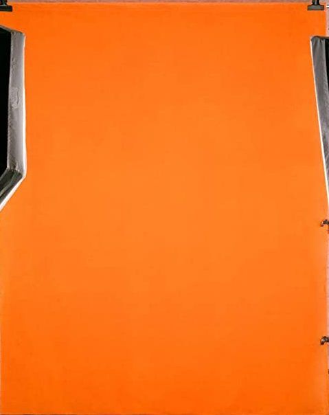 A bright orange background with metallic clamps visible on the edges.