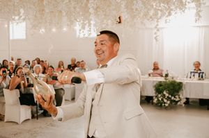 Four wedding reception photos showing celebration with dance, speeches and decor in an elegant white banquet hall setting.