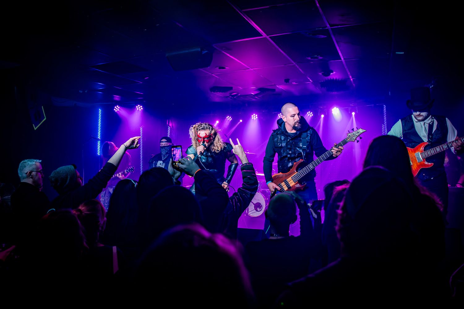 local band performing in front of crowd in a small venue in Virginia Beach, Virginia.