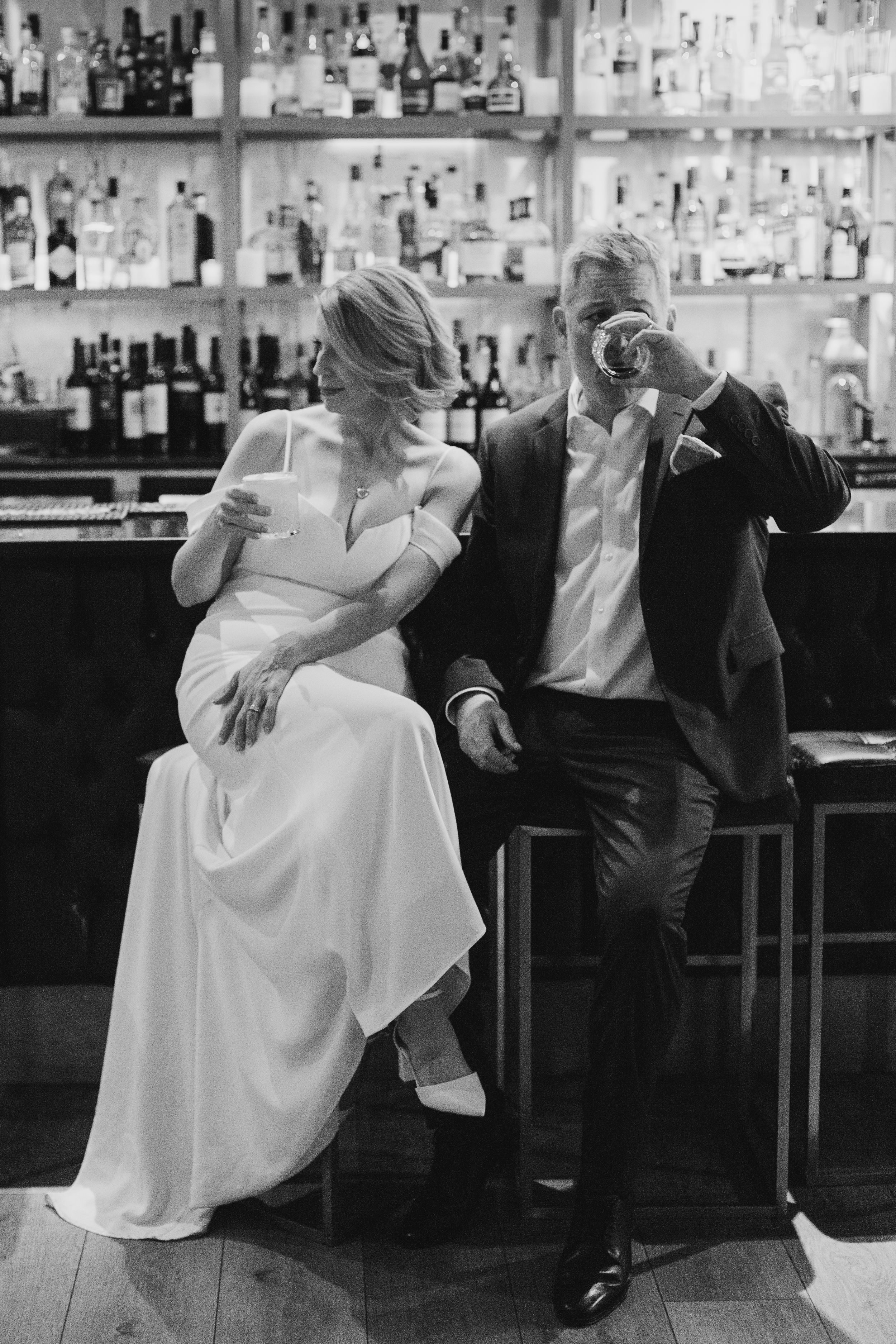 A newly married couple having a drink in a bar