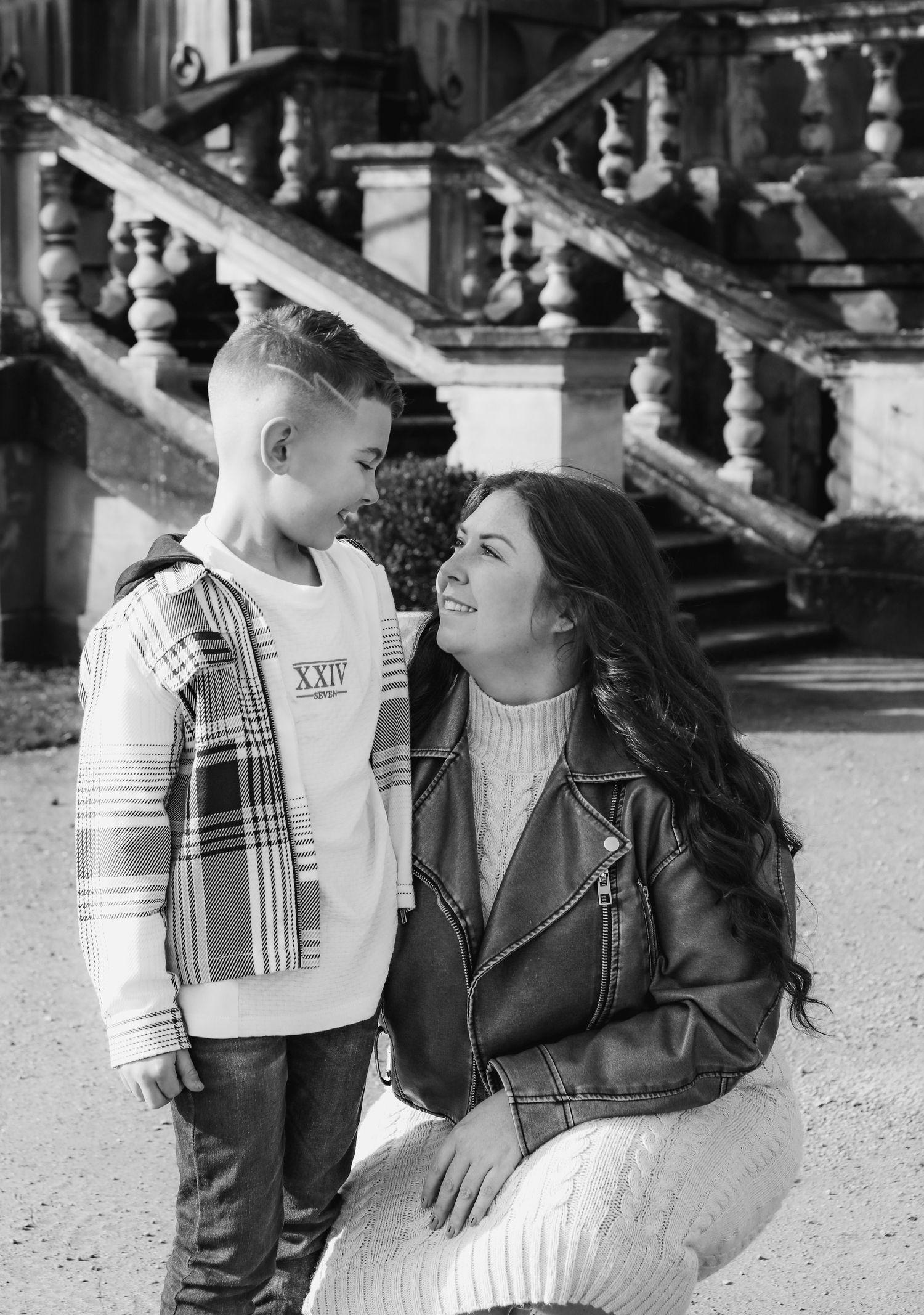 Black and white portrait of a loving moment between parent and child  in an outdoor setting during family shoot in Nottingham