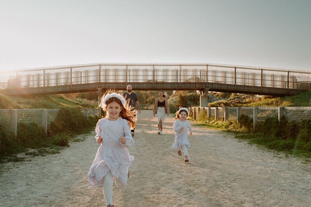 Scenic family beach photography session at sunset with a boardwalk and ocean backdrop.
Altona Family Photographer Melbourne