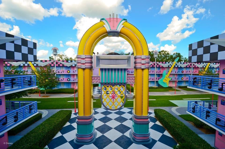 Colorful archway with checkered pattern courtyard at Disney's All-Star Resort.