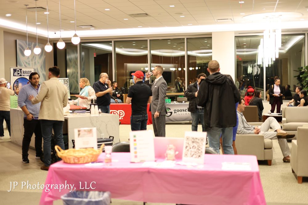 Large indoor gathering space with tables and decorations set up for a special event.