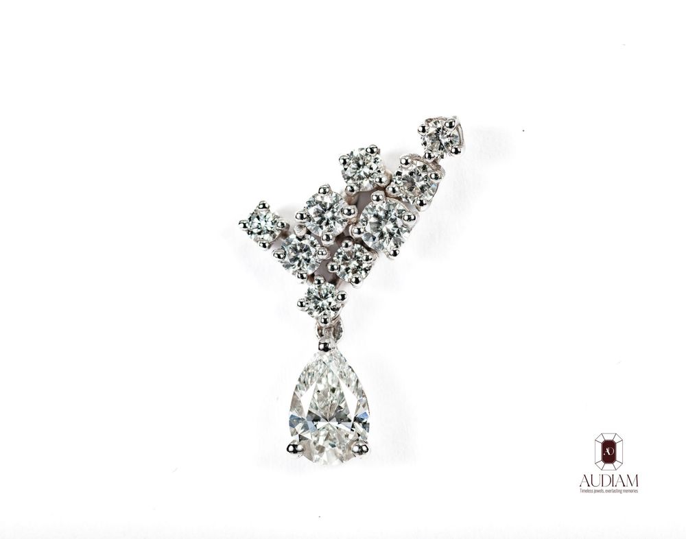Elegant diamond earring design sketch showing detailed gemstone placement and technical specifications.