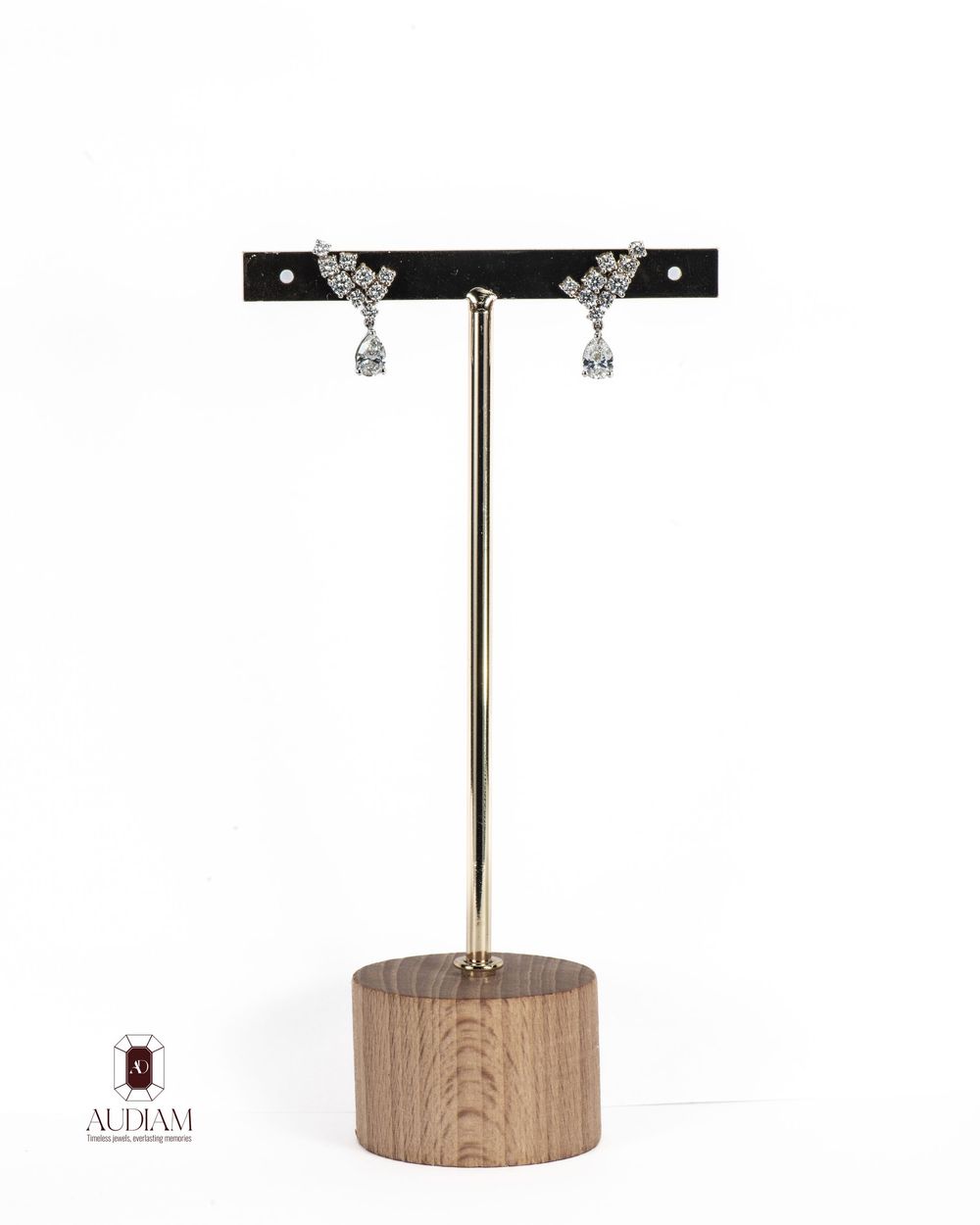 Wooden jewelry display stands with black T-bars for necklaces and earrings on white background.