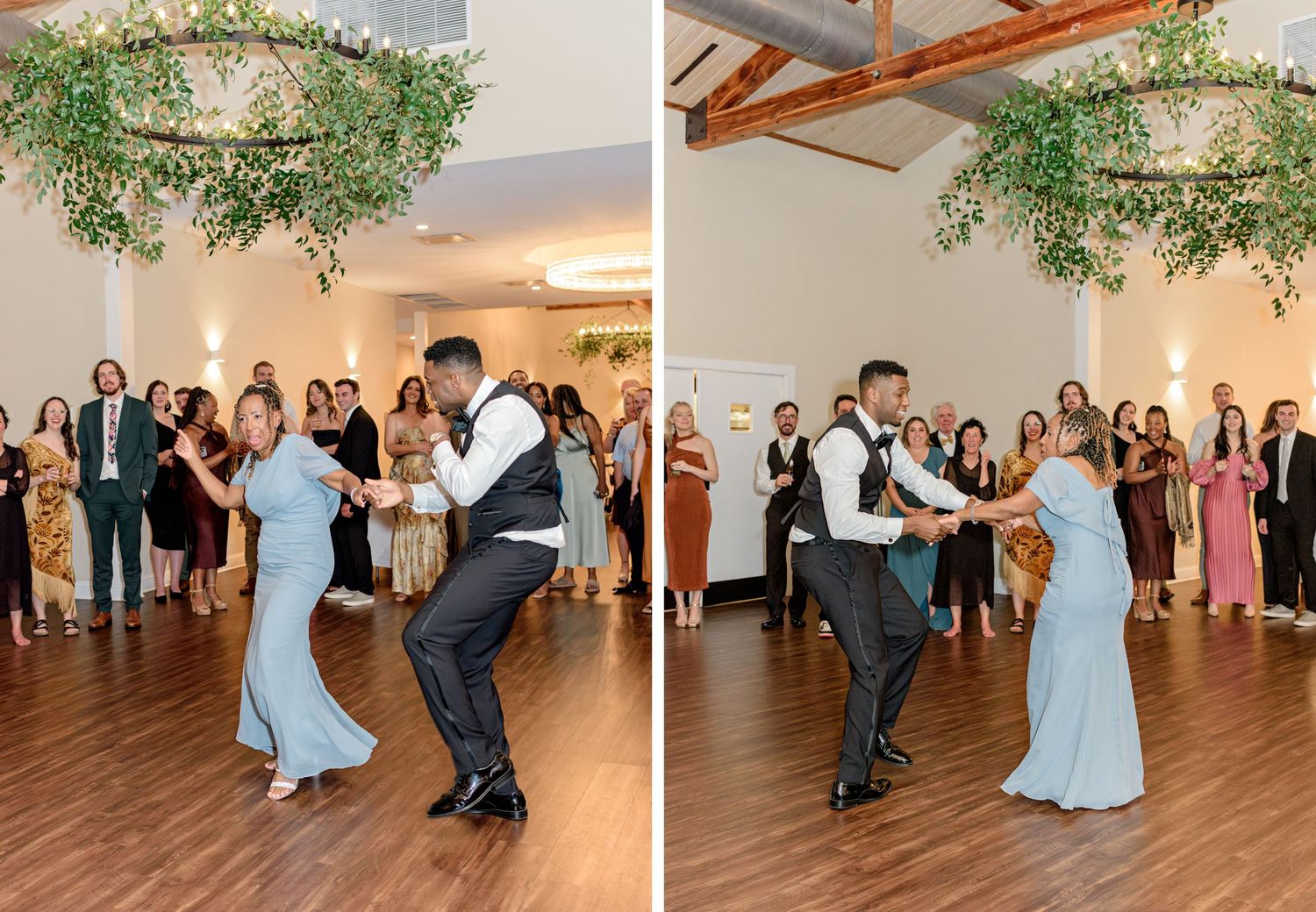 Guests in formal attire dance energetically on a wooden floor beneath a hanging greenery wreath.