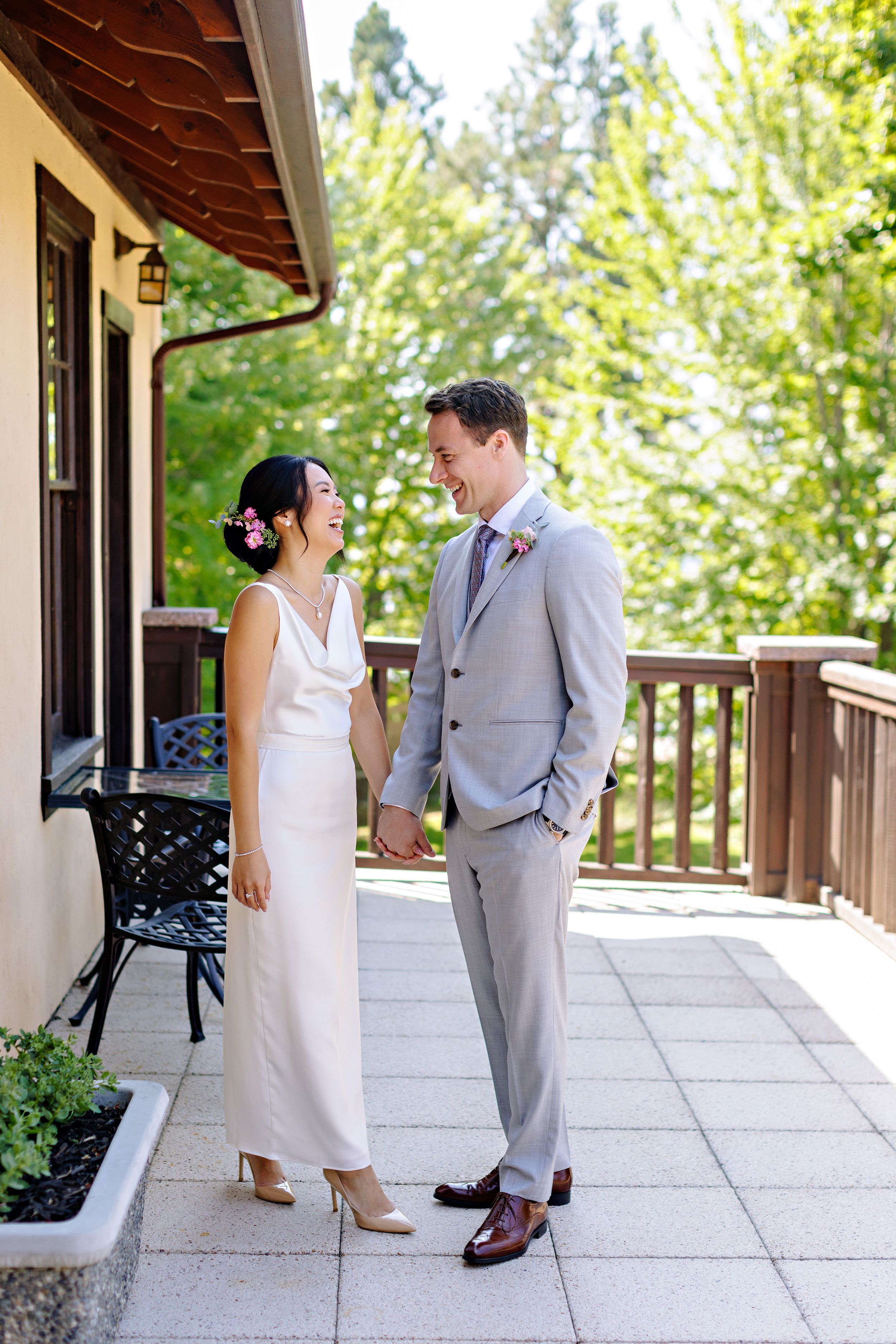 bride and groom holding hands